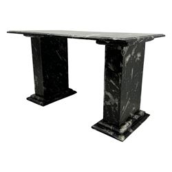 Marble hall table with orthoceras and goniatite inclusions, the rectangular top upon two rectangular stepped plinths, H78cm, L135cm, D77cm