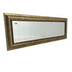 Rectangular wall mirror in gilt famed, bevelled glass plate