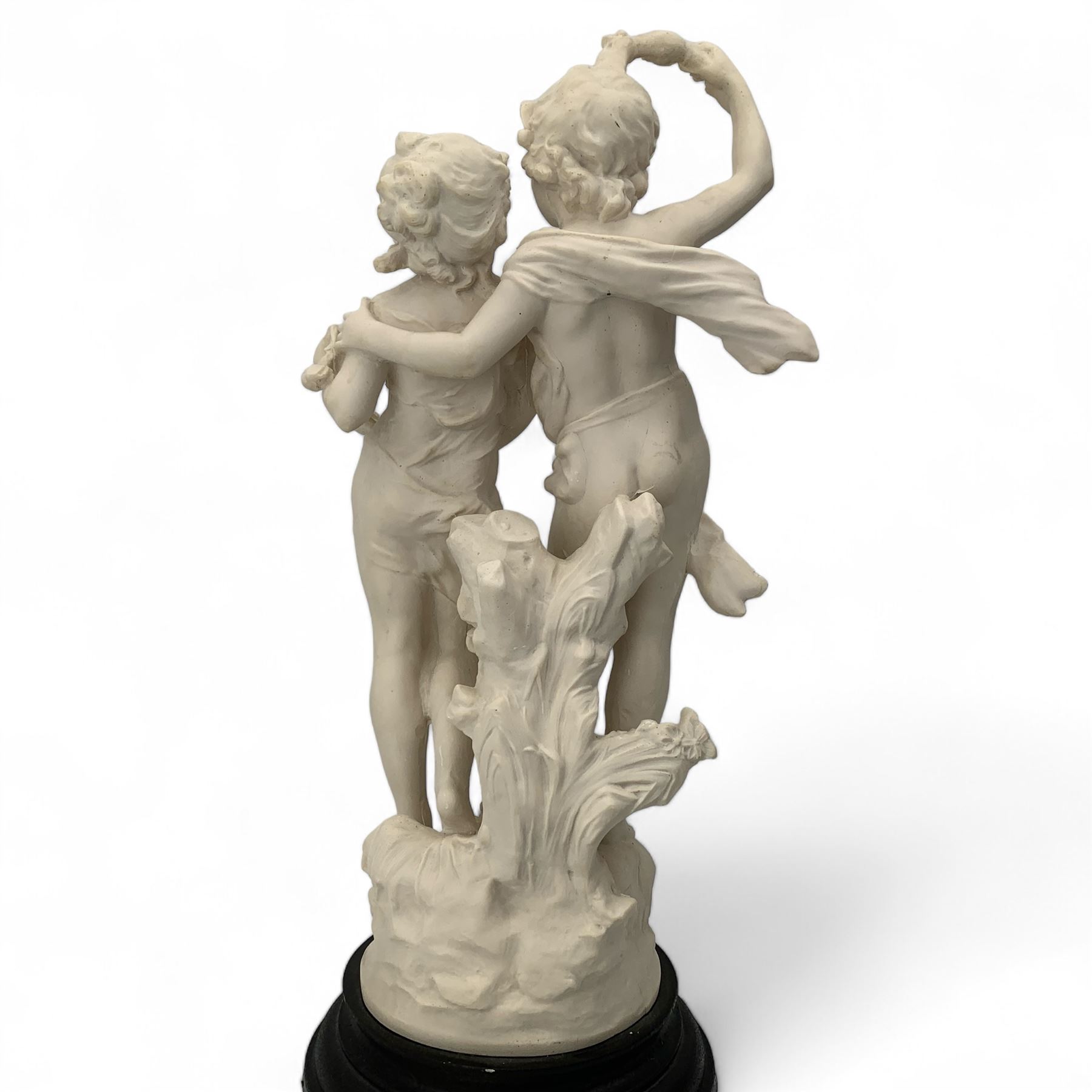 After Auguste Moreau, 20th century faux alabaster figural group 'La Fete Des Fleurs', on circular ebonised plinth, H57cm