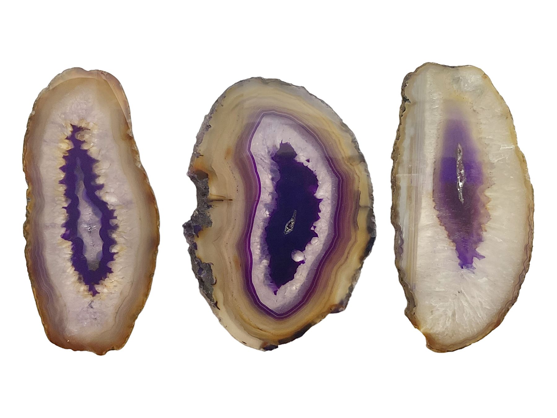 Three purple agate slices, polished with rough edges, of various sizes largest H7cm, L10cm