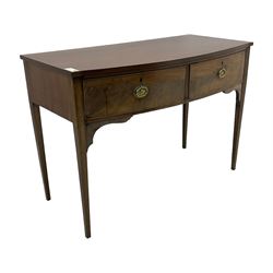 19th century mahogany bow-front serving table, fitted with two cock-beaded drawers with oval pressed brass handles decorated with urns, on square tapering supports 