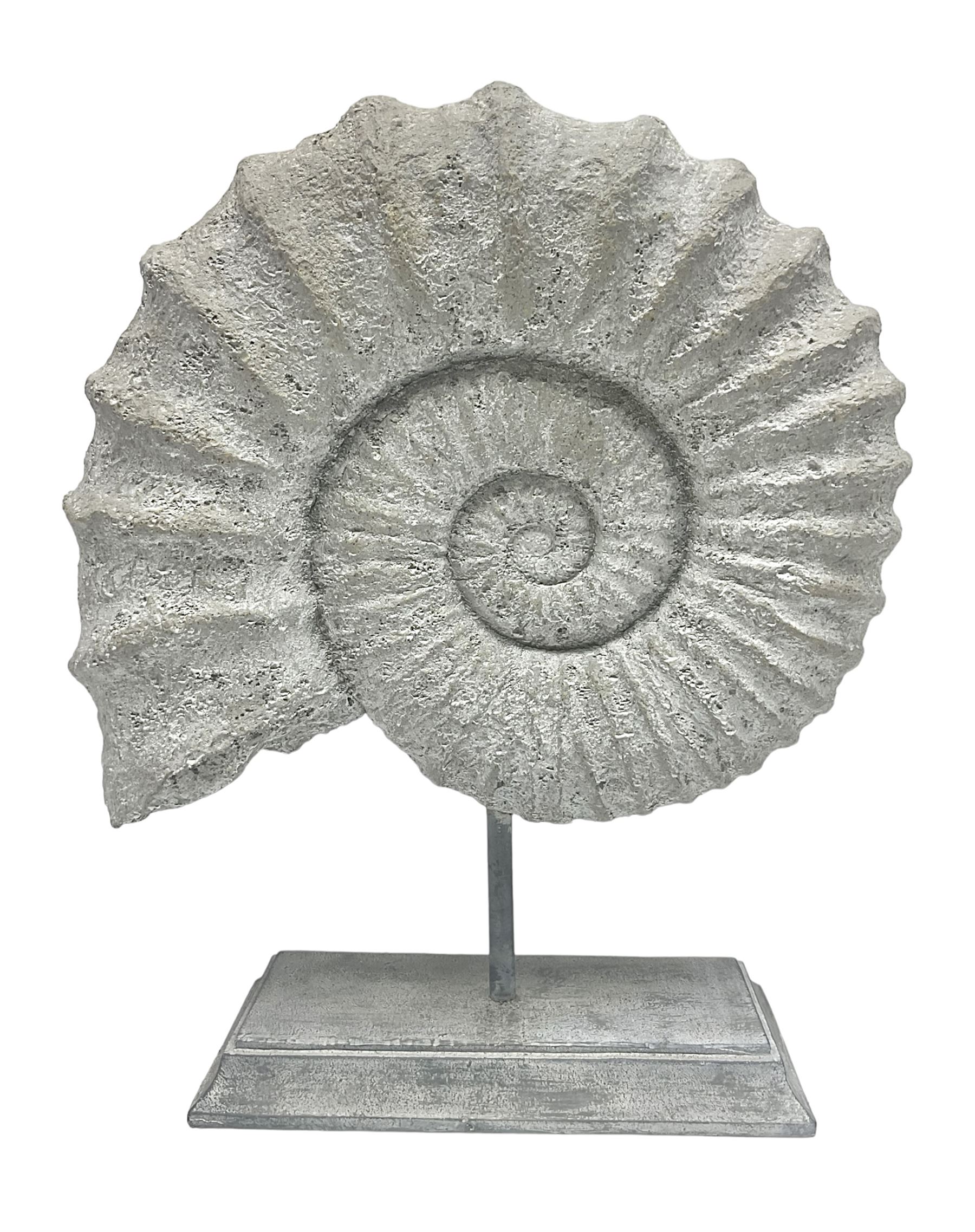 Composite Ammonite, raised on a wooden stepped plinth, H36cm