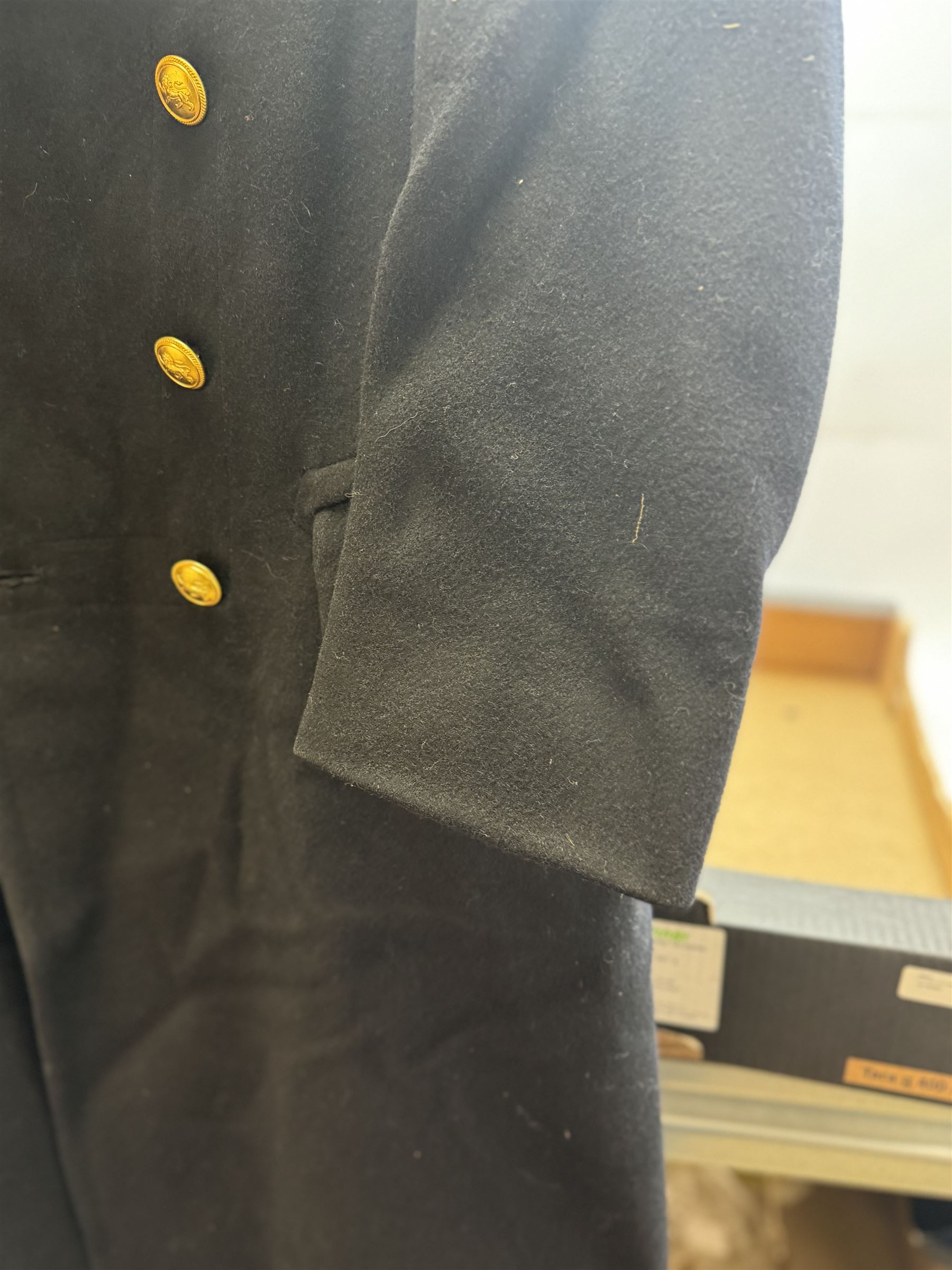 Royal Navy Lieutenant's Frock Coat by Haycock and Jarman, together with other naval accessories, including four pairs of Captain's insignia, six pairs of Captain's shoulder boards, a Merchant Navy cap badge and a collection of other badges, buttons and shoulder boards 