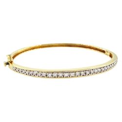 18ct gold channel set, graduating round brilliant cut diamond hinged bangle, stamped 750, ...