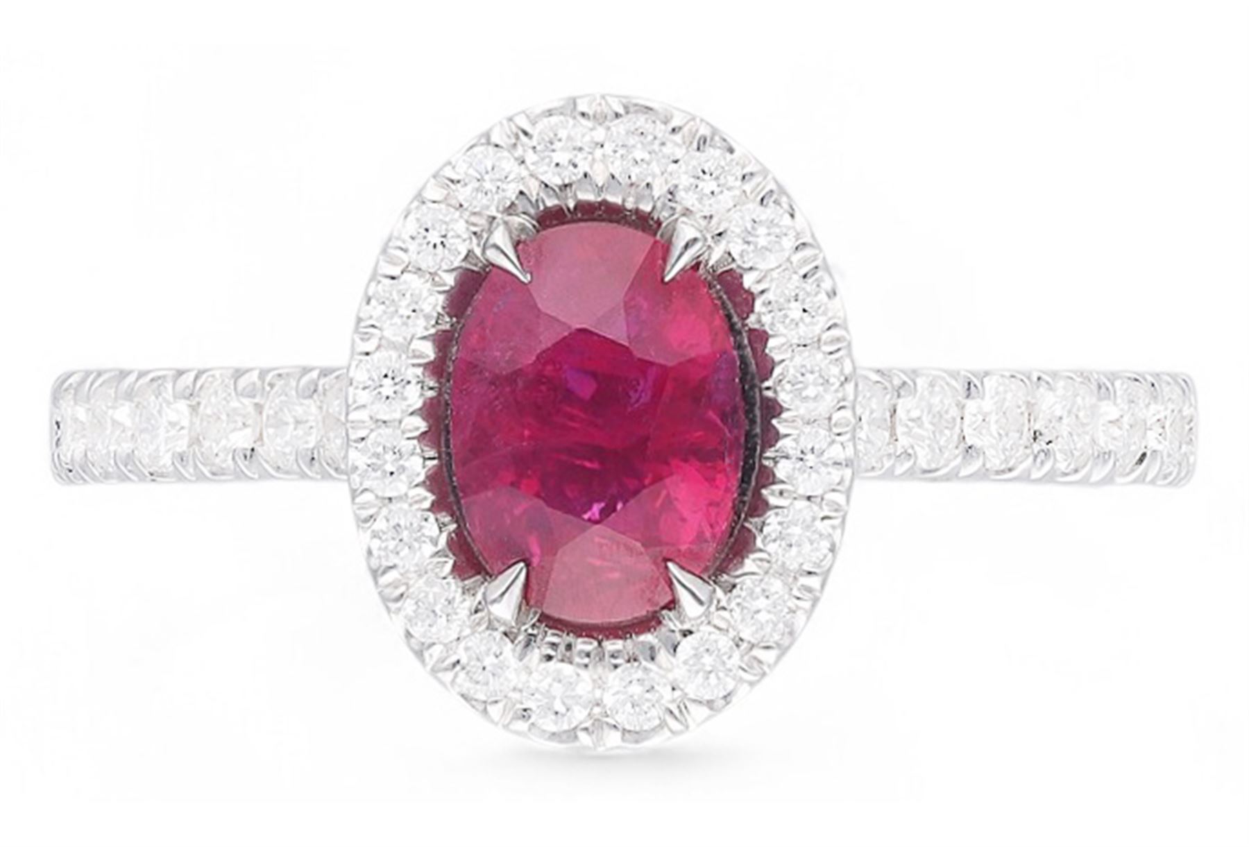 18ct white gold oval cut ruby and round brilliant cut diamond cluster ring, with diamond set shoulders, hallmarked, ruby approx 0.80 carat, total diamond weight 0.37 carat 