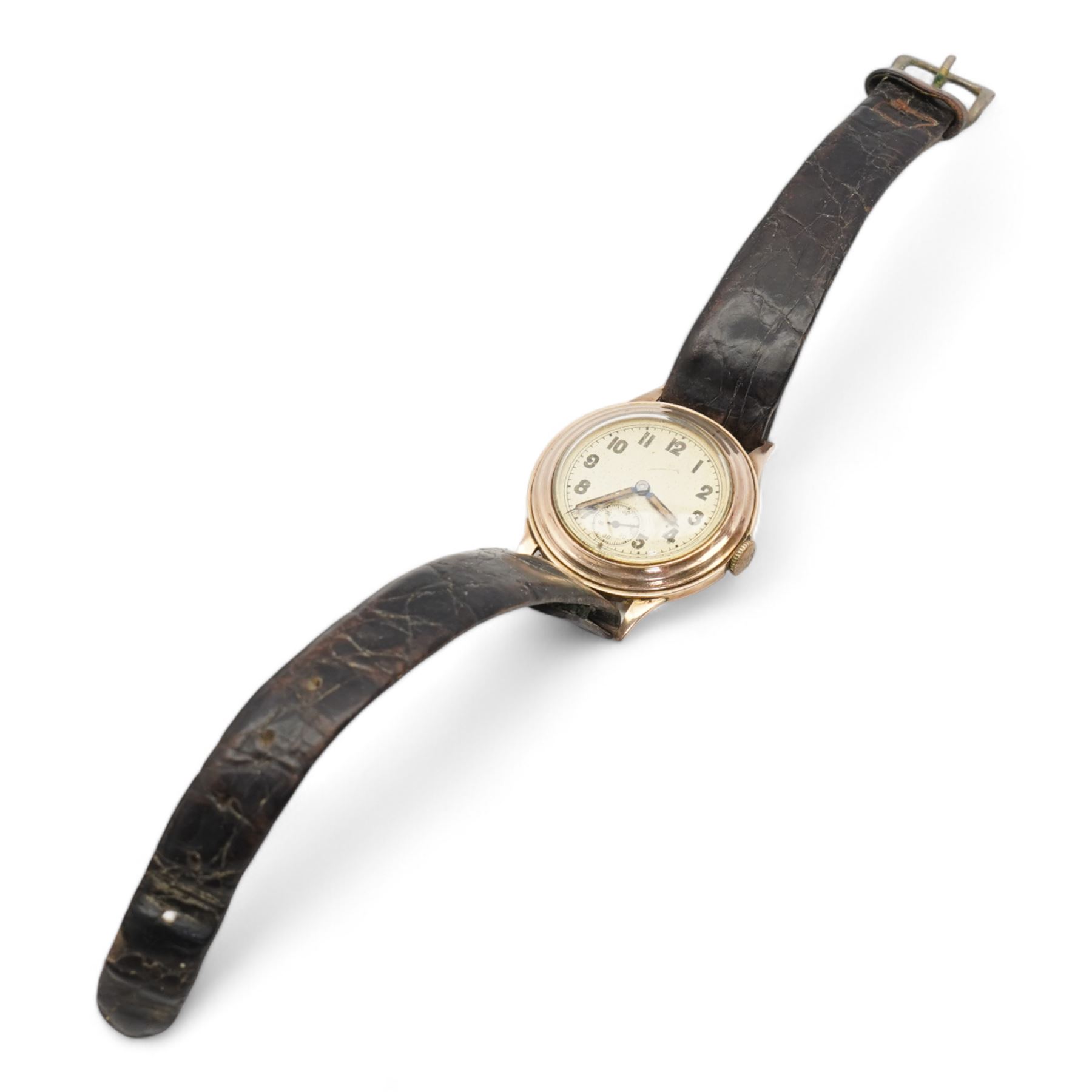 9ct rose gold manual wind wristwatch, silvered dial with Arabic numerals and subsidiary seconds dial, case by British Watch Cases Ltd, Edinburgh 1989, on a black leather strap