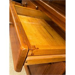 Large 20th century oak dresser, projecting cornice over open arched central section with two shelves, flanked by two panelled cupboards with two shelves, lower section with three drawers above three cupboards, on stile supports 