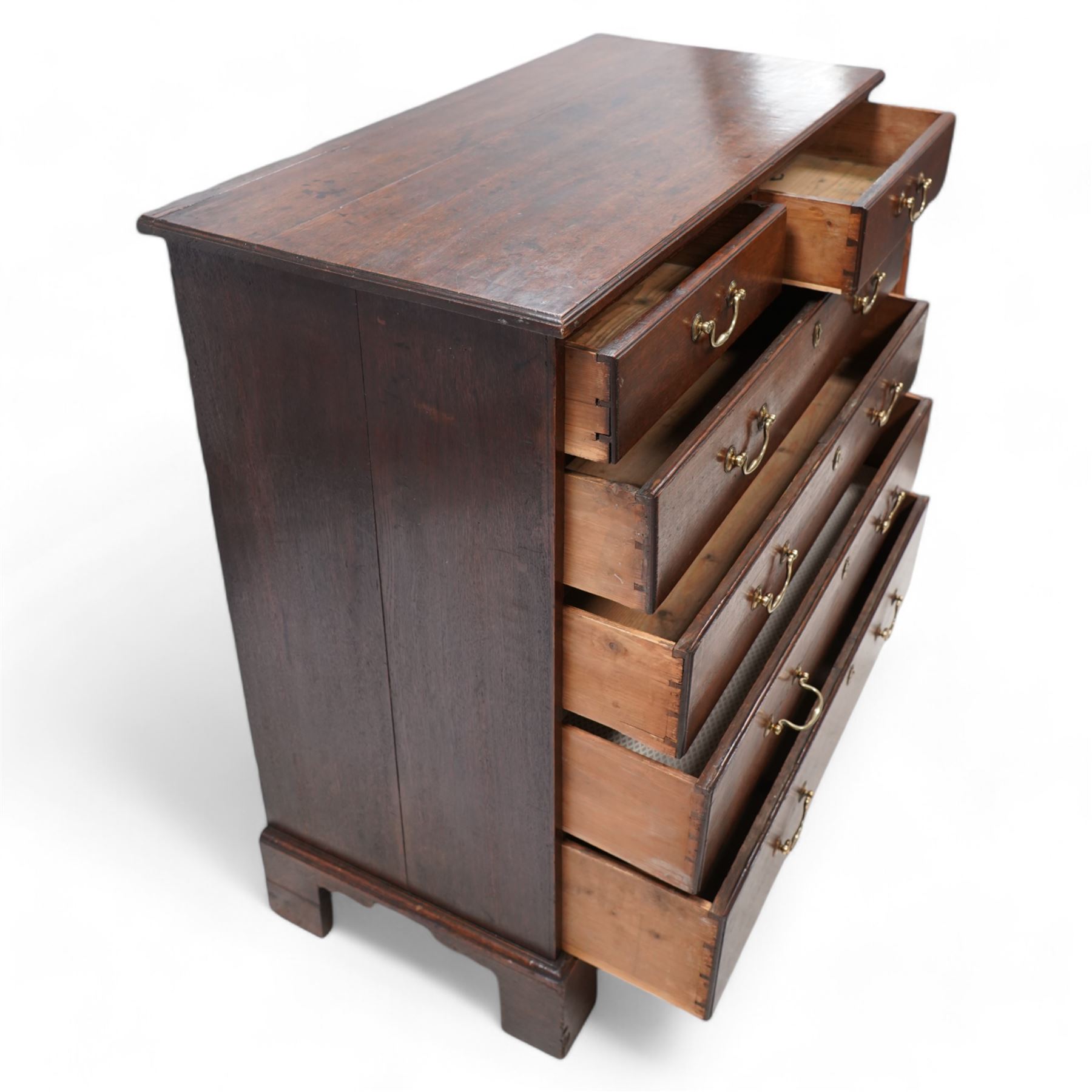 George III oak chest, rectangular protruding top with moulded edge, fitted with two short over four long graduating drawers, with moulded facias and brass swan neck handles, lower moulded edge on bracket feet