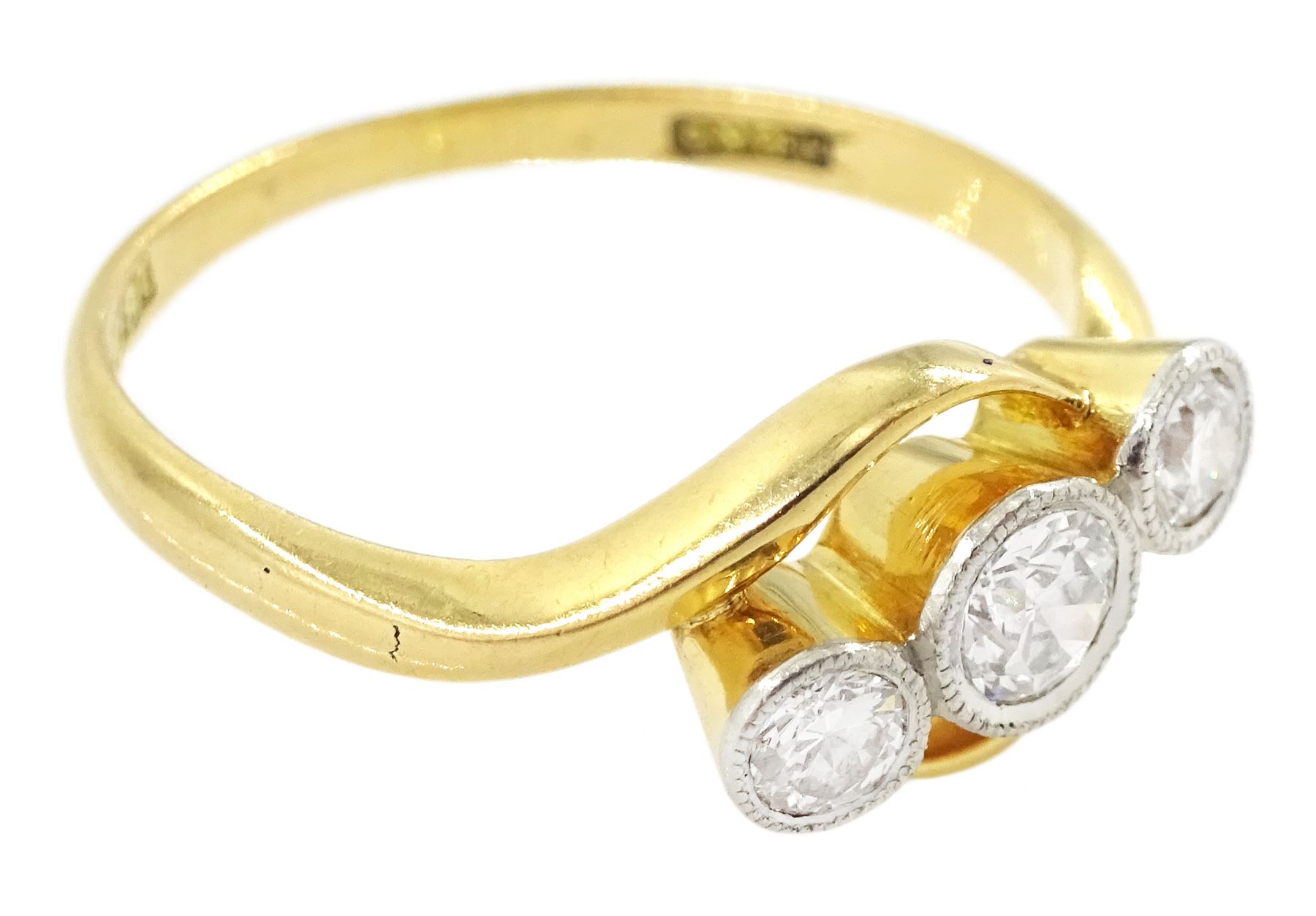 Early 20th century milgrain set three stone old cut diamond ring, stamped 18ct, total diamond weight approx 0.35 carat