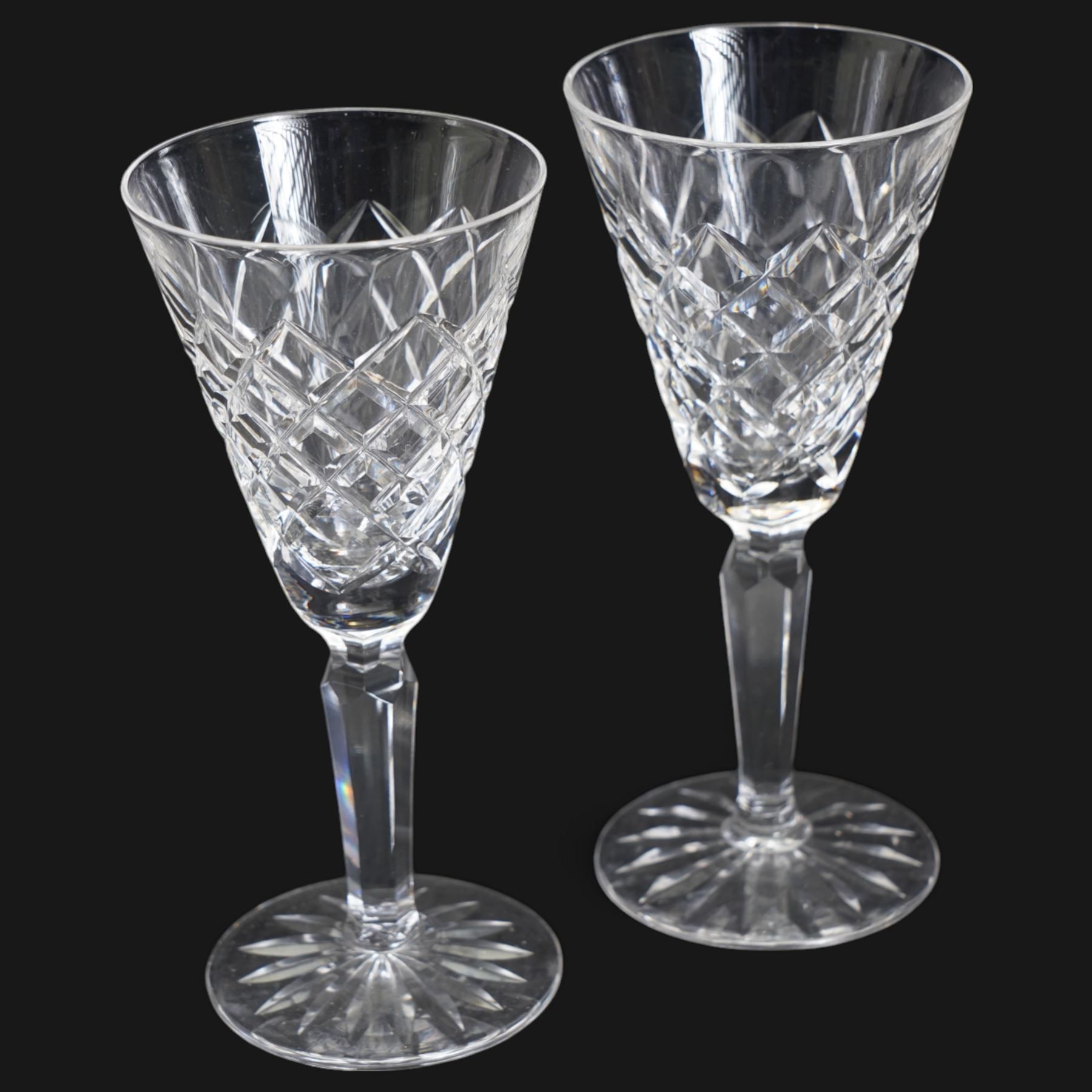 Suite of Waterford Tyrone pattern crystal to include six water goblets, H18cm, six red wine glasses, H17cm, seven white wine glasses, H16cm, six champagne flutes H18cm, six port glasses H14cm, nine champagne coupes, eight tumblers, six dessert bowls and serving/ fruit bowl