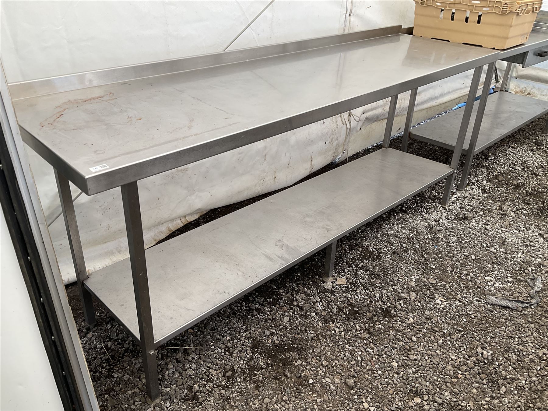 Large stainless steel two tier preparation table, raised back - THIS LOT IS TO BE COLLECTED BY APPOINTMENT FROM DUGGLEBY STORAGE, GREAT HILL, EASTFIELD, SCARBOROUGH, YO11 3TX