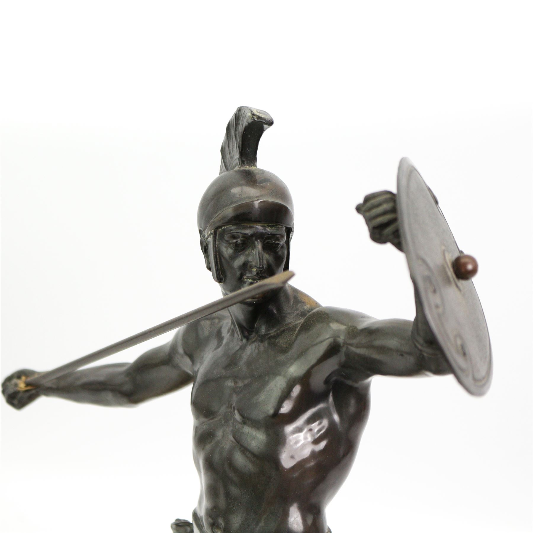 20th century patinated spelter model of a Spartan warrior holding a spear and shield, upon a rectangular marble plinth, H38cm x W28cm 