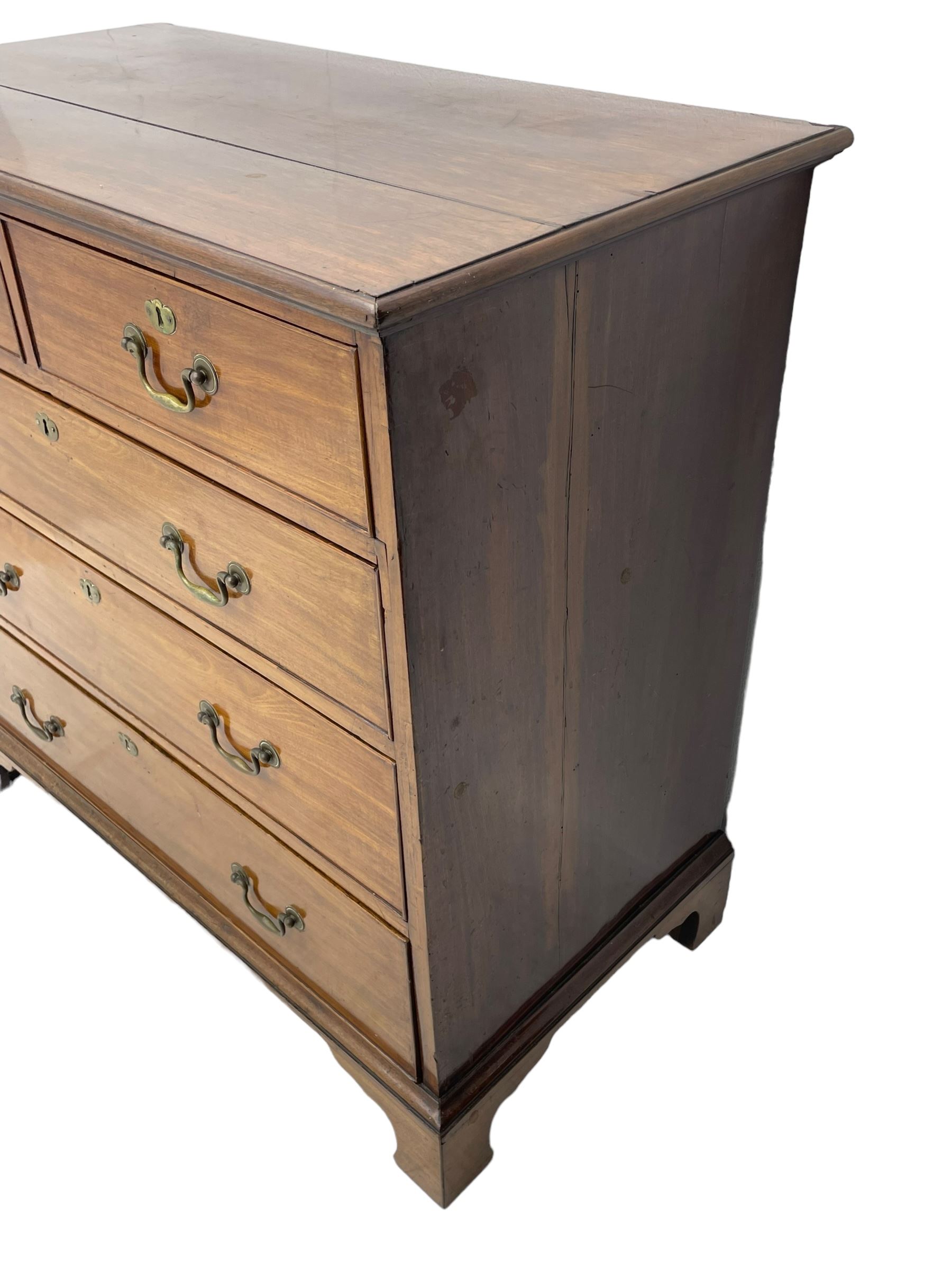 George III mahogany chest, moulded rectangular top over two short and three long cock-beaded drawers, fitted with brass swan neck handles and circular plates, on bracket feet