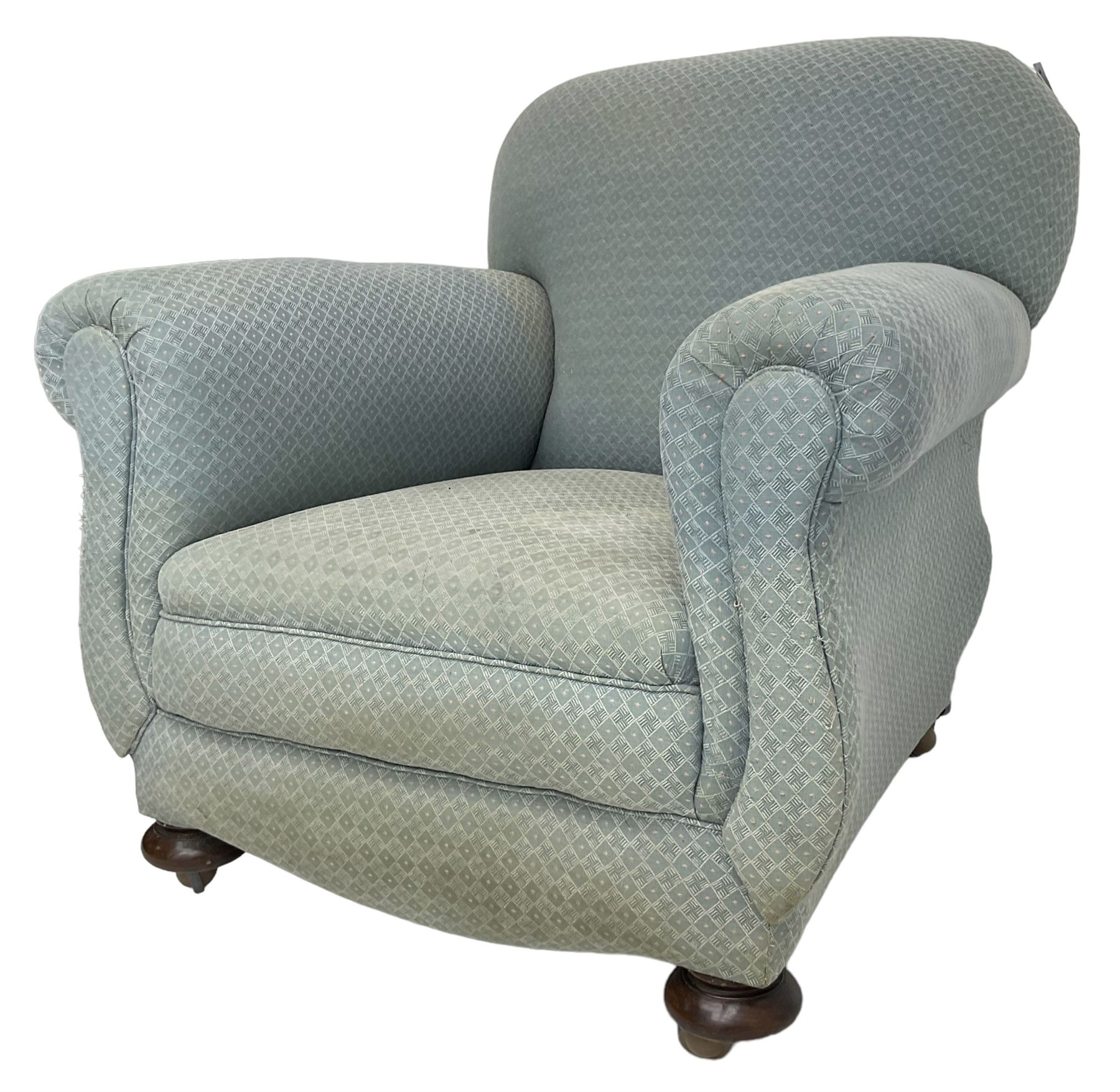 20th century traditional shape armchair, curved back and rolled arms, upholstered in light blue patterned fabric, on turned front feet