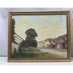 Keith Sutton (British 1924-1991): A Sussex Street, oil on canvas signed 44cm x 56cm; R Gill (Northern British 20th Century): Yorkshire Village on a Hill, oil on board signed 40cm x 70cm (2)