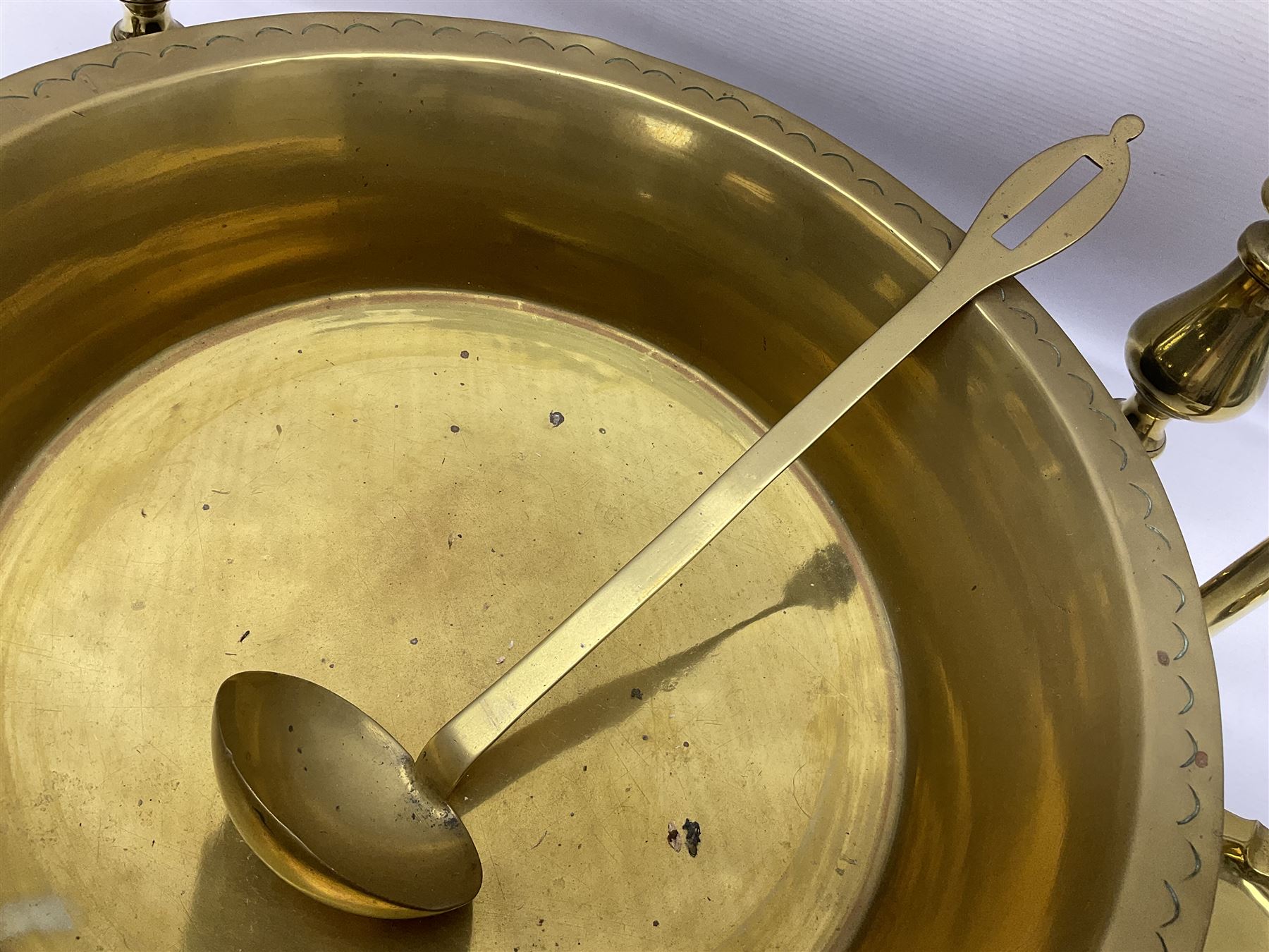 Collection of early 20th century and later brass, to include a large bowl with punched decoration to rim, pair of candlesticks, inkwell, weights, horse brasses, etc 