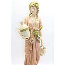 Royal Dux figure no. 686, modelled as a female water carrier, carrying two urns and wearing flowing green and pink robes, with applied pink triangle mark beneath, H61cm