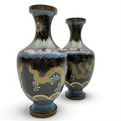 Pair of Japanese cloisonné vases of baluster form, decorated with dragons chasing a flaming pearl, H26cm 