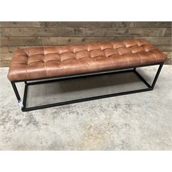 Two rectangular metal framed benches, upholstered in buttoned tan leather