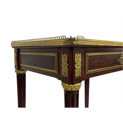 Late 19th century French figured plum pudding mahogany side table, canted rectangular white marble top with raised gilt metal gallery, fitted with a single frieze drawer, central extending floral cast ormolu escutcheon and applied moulded edging, on tapering turned and fluted supports with brass cups and castors, decorated with cast foliate mounts and foliate cast collars 