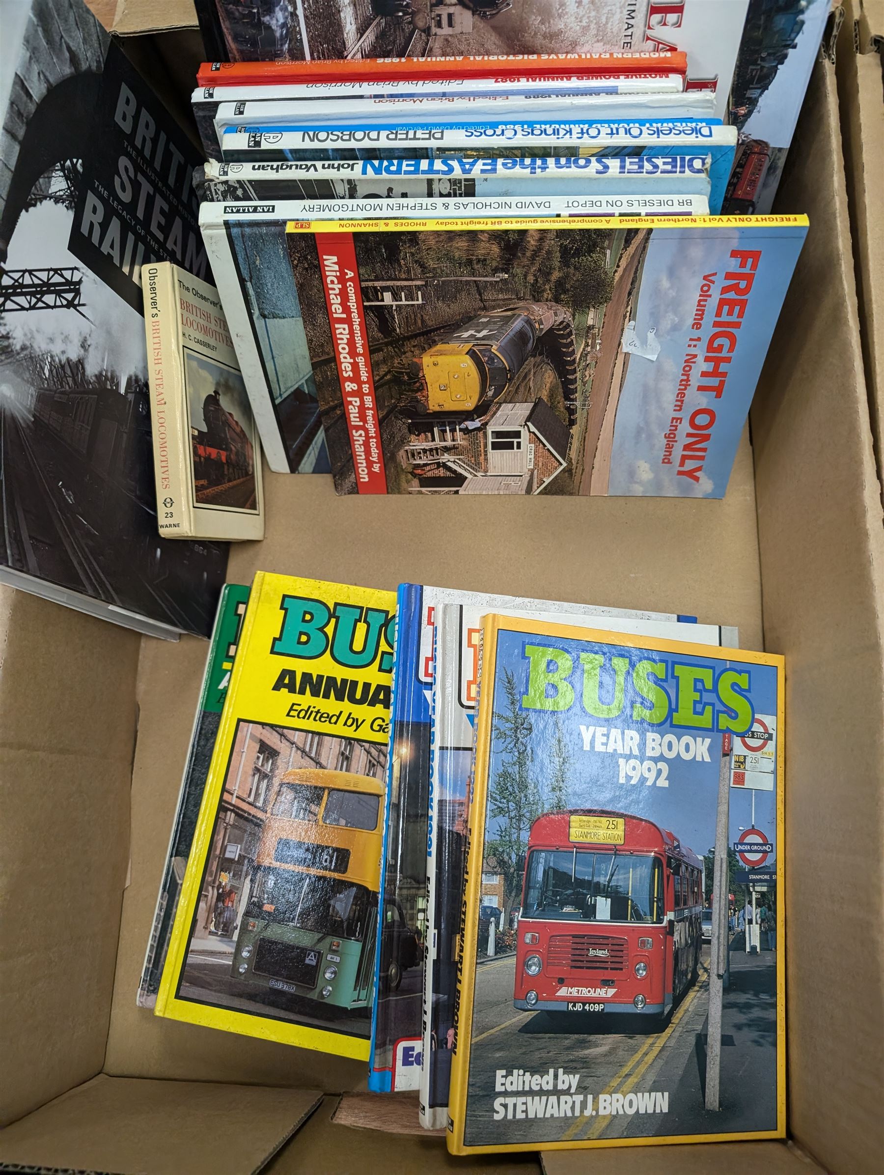 Railway and transport reference books, including several editions of Buses Year Book 1981-1992, in two boxes