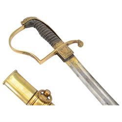 German Saxon 1st Empire Light Cavalry officer's sword c1820s, the 79cm clipped curving blade engraved with the crest of Hanover and various battle trophies with traces of blueing and gilding, brass hilt with knucklebow, foliate square langets, ornate downswept quillon, wire-bound fish skin grip with lion's head pommel; in brass scabbard with two suspension rings L95cm overall