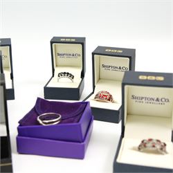 Twelve silver gemset rings, including a jet ring with Celtic design shoulders and a garnet two row cluster ring, amethyst cluster ring and an early 20th century citrine ring