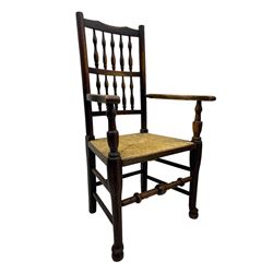 Matched set of twelve 19th century elm Lancashire spindleback dining chairs, shaped cresting rail over spindle back, rush seat, on turned supports united by turned stretchers, ring and globular turned front stretcher 