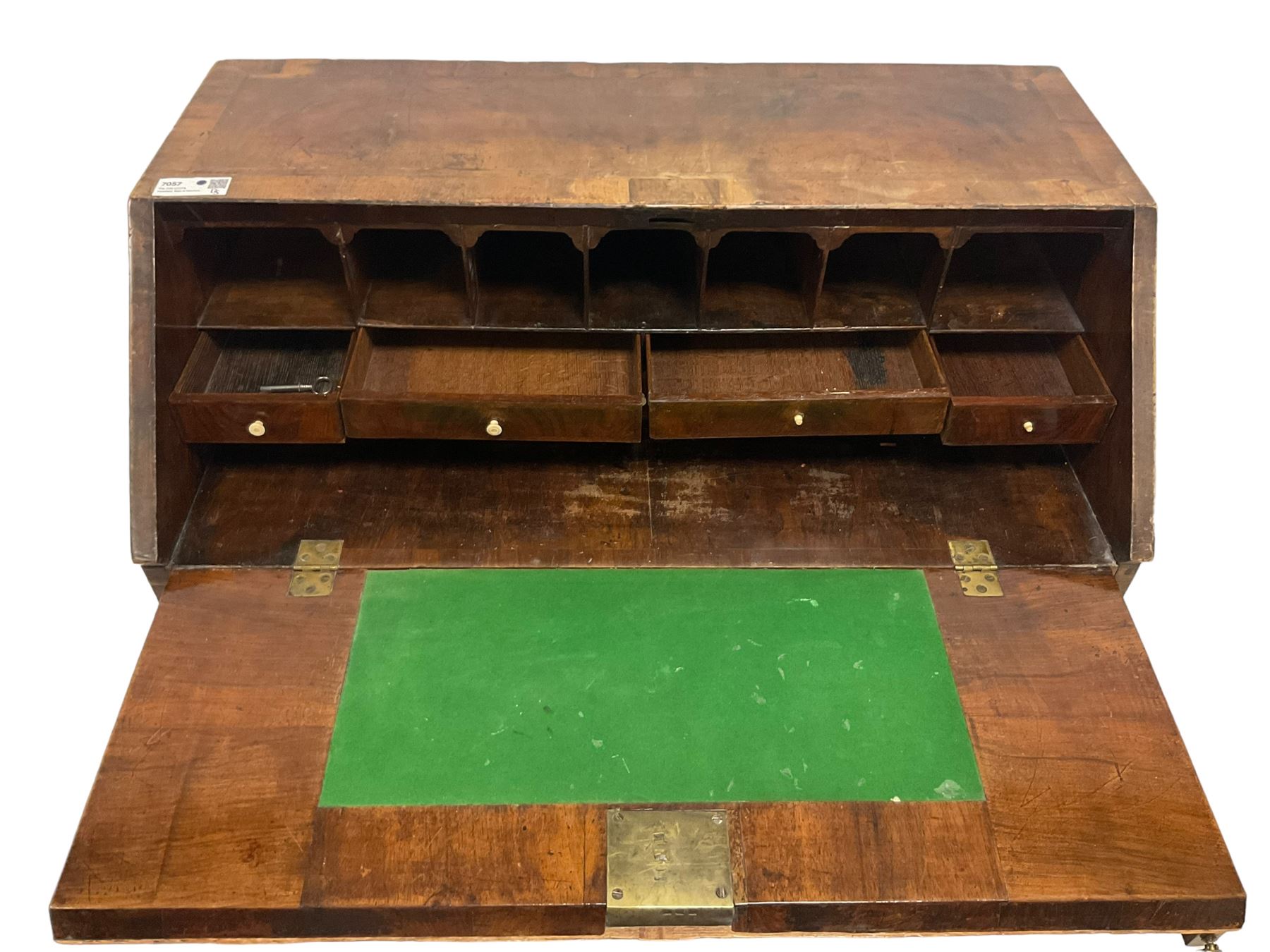 18th century walnut bureau, crossbanded and feather-banded rectangular top and fall-front, enclosing fitted interior with pigeonholes and correspondence drawers with bone handles, over two short and three long graduating drawers with moulded facias and original brass handles, on bracket feet