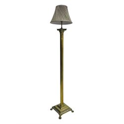 20th century brass standard lamp, Corinthian column stem on moulded square base with paw feet 