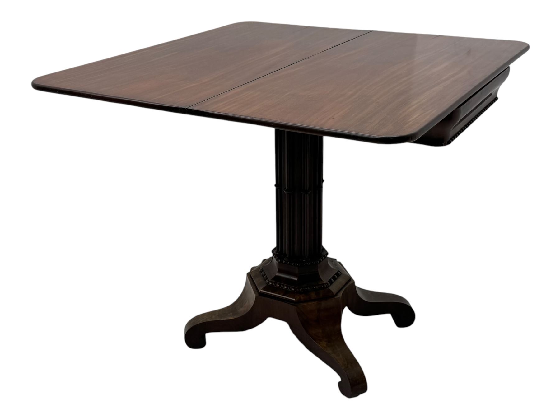 Victorian mahogany tea table, rectangular fold-over and swivel action top with rounded corners, ogee moulded frieze with applied bead, octagonal column mounted by cluster column uprights, on step moulded octagonal foot with applied beading, splayed and scrolled feet with recessed castors 