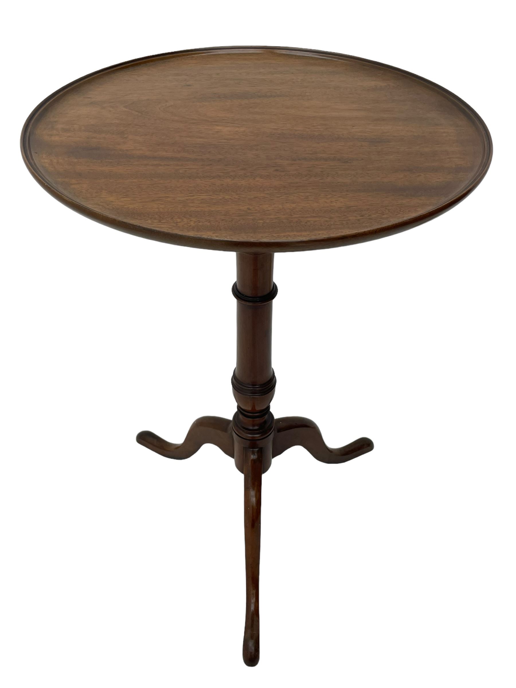 George III mahogany tripod table, circular moulded dished tilt-top, ring turned stem on three splayed supports 