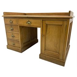 20th century oak desk, moulded rectangular top with raised back and inset leather writing surface, fitted with five drawers and single panelled cupboard, on moulded plinth base