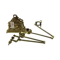 Brass letter rack, with two divisions, the pierced front and back modelled as a flowering urn hung with floral swags, H18cm, together with a pair of gilt metal extendable candle sconces, fully extended L50cm