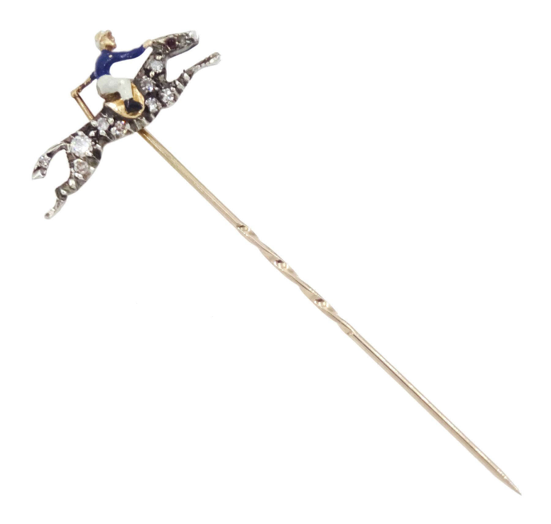 Early 20th century gold and silver, diamond and enamel stick pin, the galloping horse set with single cut diamonds, the jockey with blue and white enamel, in velvet and silk lined box