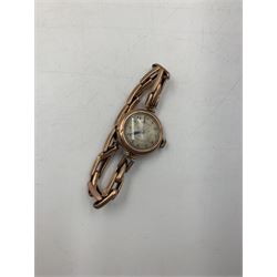 Early 20th century keyless fob watch, white enamelled dial with Roman numerals and subsidiary seconds dial, outer case stamped 14K, 9ct gold cased Rite-Tyme mechanical wristwatch, on a gilt stainless steel bracelet, a ladies 9ct gold cased mechanical movement wristwatch, with blue enameled case, on a rolled gold bracelet strap, ladies 9ct gold mechanical movement wristwatch on an expanding bracelet strap stamped 9ct and another 9ct gold cased mechanical movement wristwatch, together ladies Rotary 9ct gold cased mechanical wristwatch and ladies Bulova rolled gold mechanical wristwatch (lacking straps)