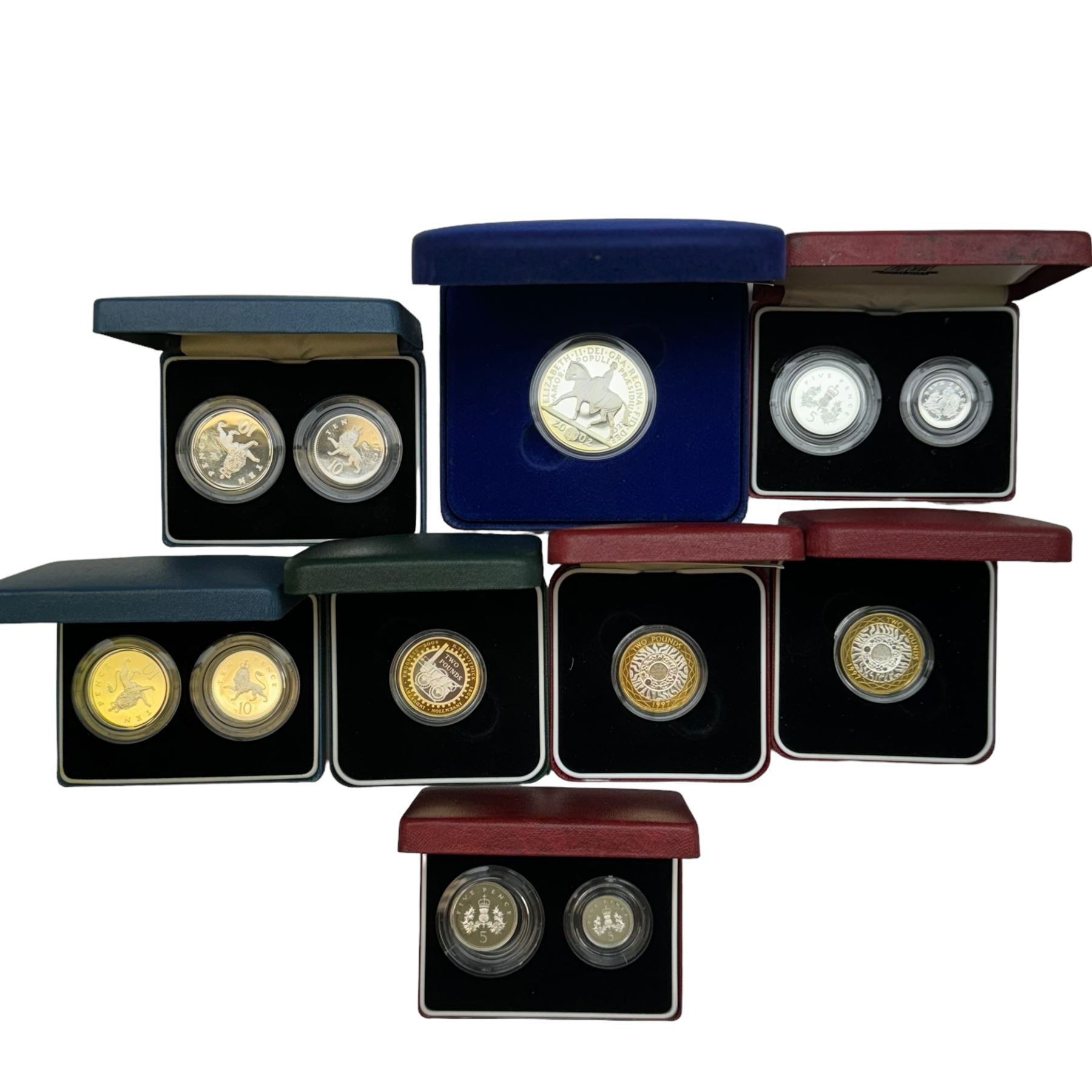 Eight The Royal Mint United Kingdom silver proof coins or sets, comprising two 1990 five pence two-coin sets, two 1992 ten pence two-coin sets, two 1997 two pounds, 2004 '200th Anniversary of the Steam Locomotive' two pounds and 2002 'Golden Jubilee' five pounds, all cased with certificates