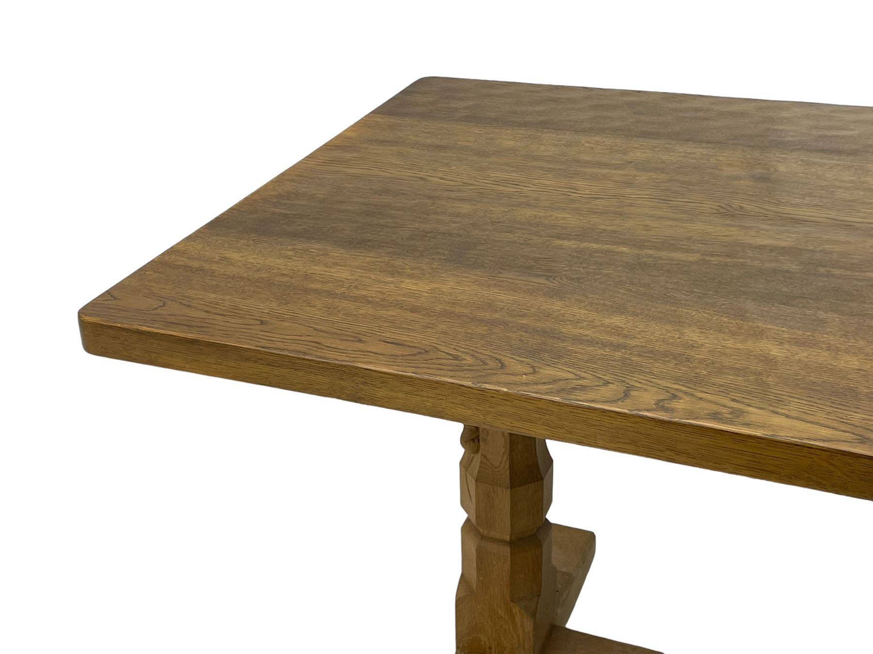 Mouseman - oak dining table, rectangular adzed top with rounded corners, octagonal pillar supports on sledge feet united by floor stretcher, carved with mouse signature, by the workshop of Robert Thompson, Kilburn