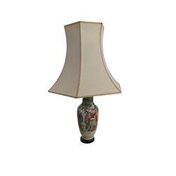 Oriental table lamp with figural decoration and fabric shade, total H70cm