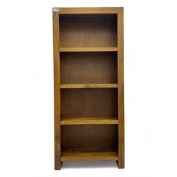 Contemporary Dakota mango wood open bookcase, rectangular form with four fixed open shelve...