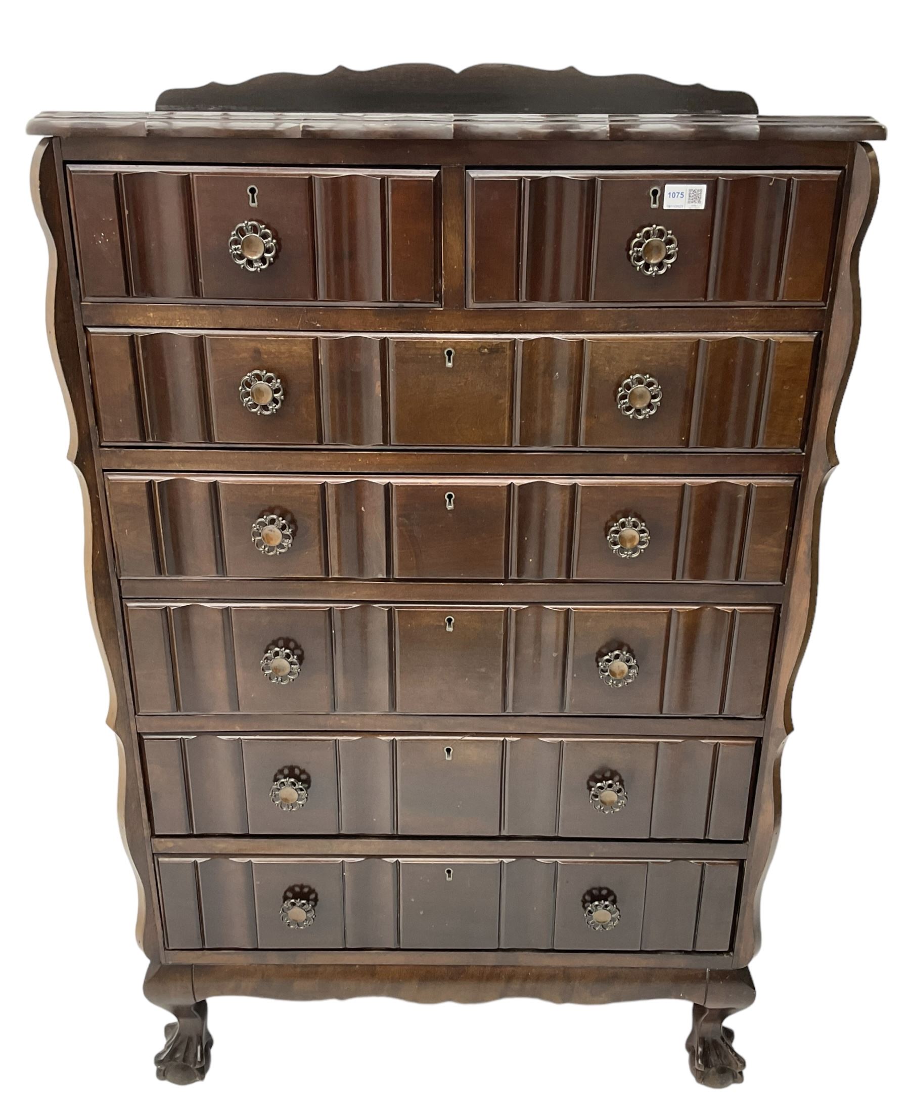 Early 20th century Dutch design mahogany chest, raised back over shaped top, fitted with two short and five long drawers, raised on ball and claw feet