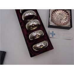 Set of six modern silver napkin rings, hallmarked London 2000, makers mark WW, together with a modern silver pin dish, hallmarked Hugh Crawshaw, Sheffield 2000, both boxed