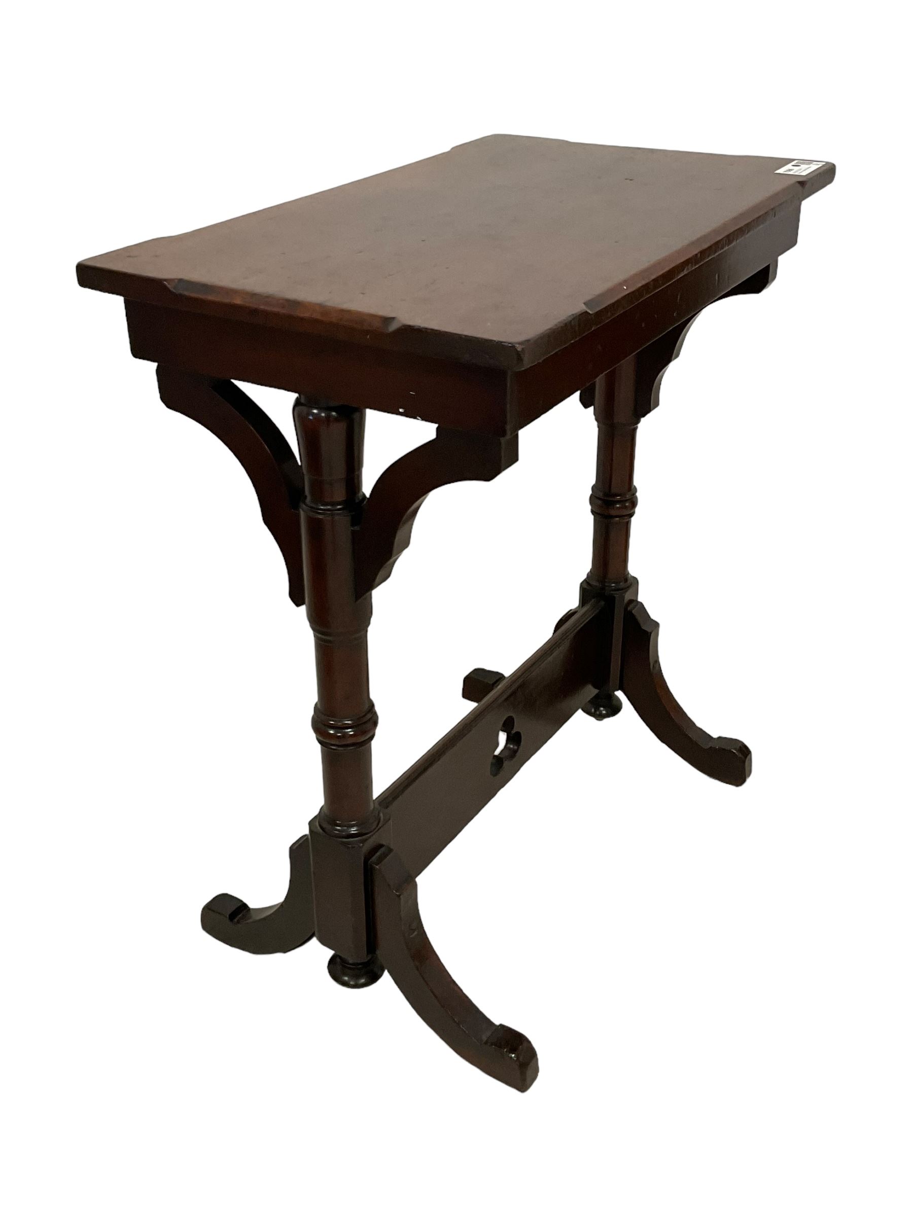 Late Victorian walnut ecclesiastical side table, rectangular top with stop chamfered edge, on turned supports united by rectangular stretcher pierced with trefoil, on splayed feet 