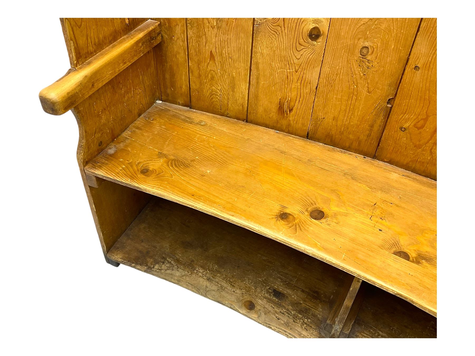 19th century pine barrel back settle, bowed boarded back on shaped end supports, with upholstered squab cushion 