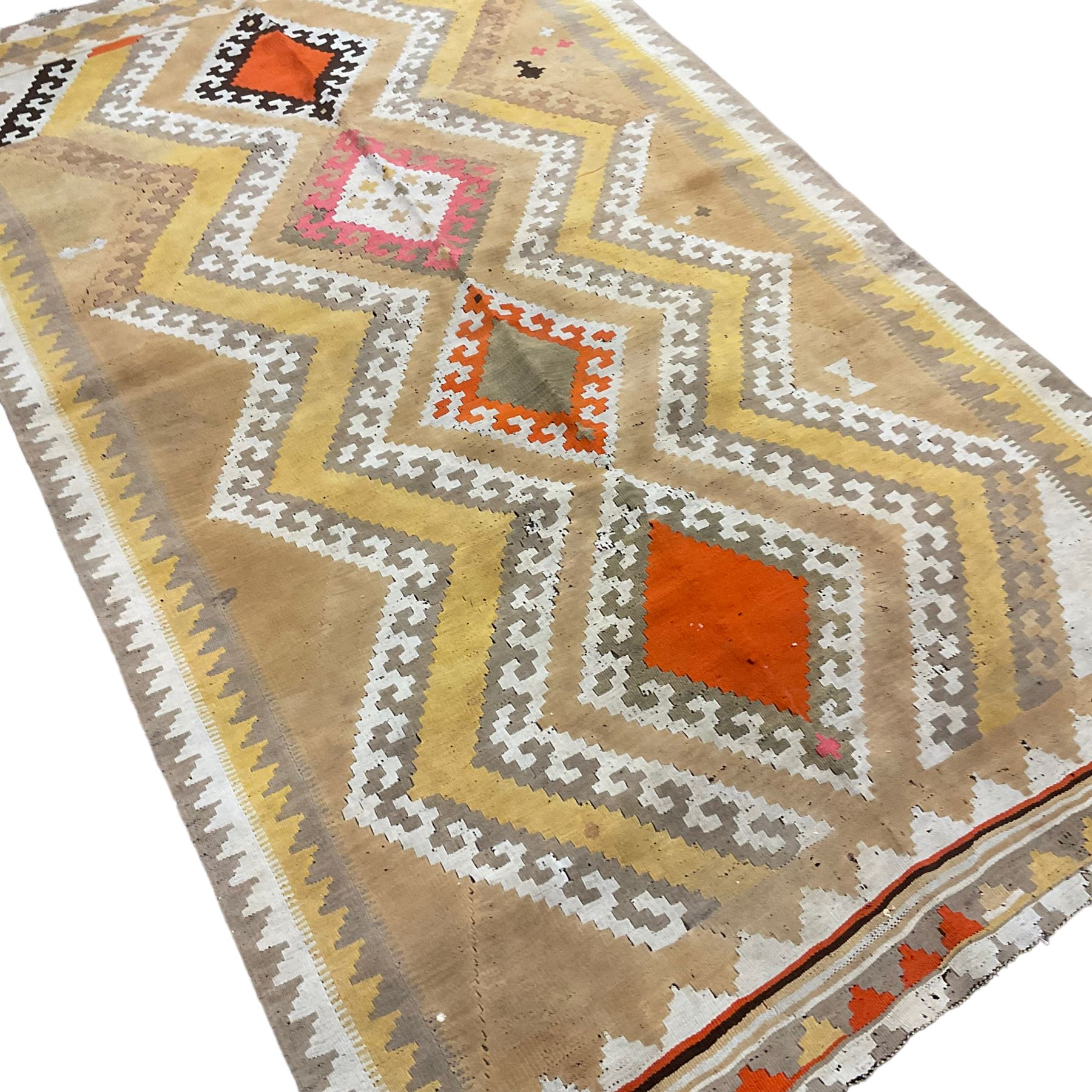 South West Persian Qashgai Kilim, mustard ground and decorated with geometric lozenges and borders 