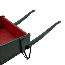 19th century green and red painted wooden wheelbarrow, flat bed with removable sides and back, wooden and wrought metal strap wheel 