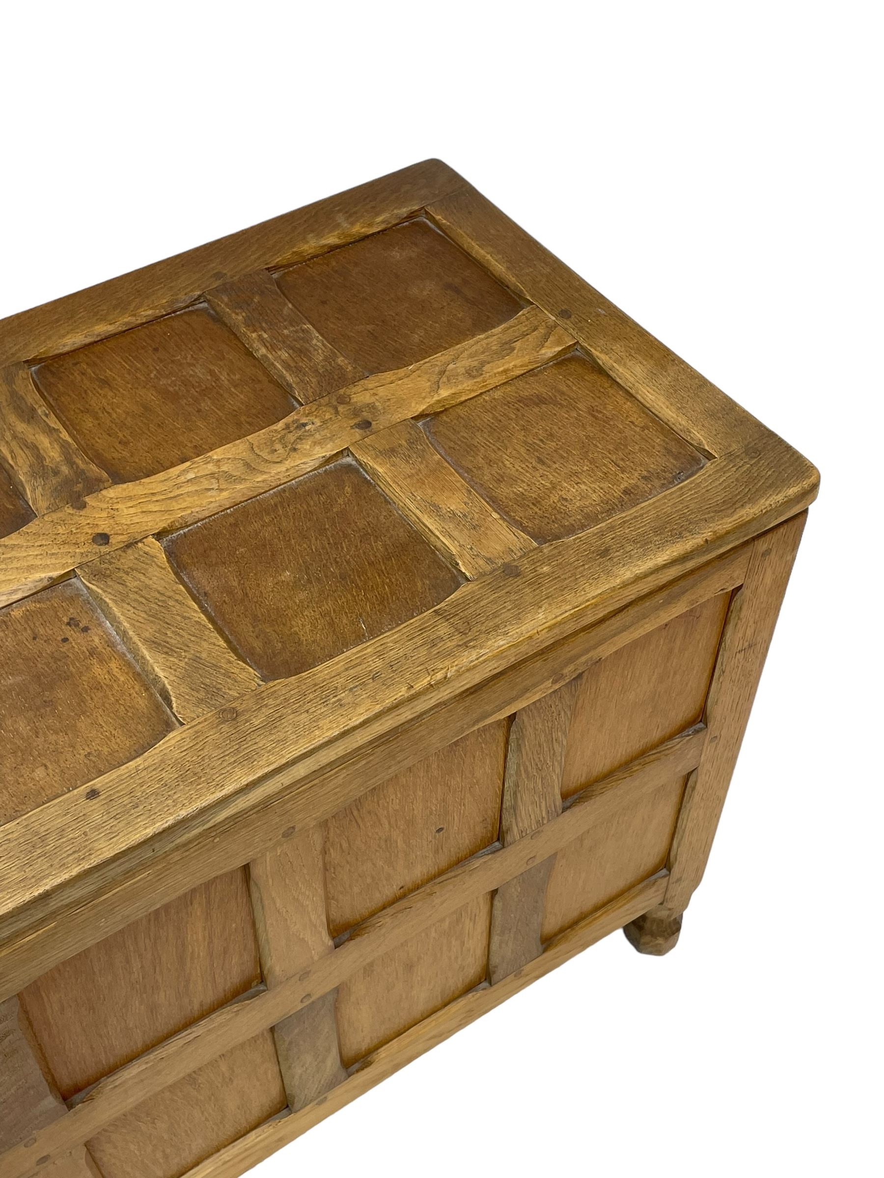 Sid Pollard (ex. Mouseman) - Yorkshire oak blanket chest, all over panelling, enclosed by hinged lid, on octagonal feet, interior plaque inscribed 'S. Pollard, Bagby, Thirsk, Yorks' 