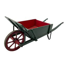 19th century green and red painted wooden wheelbarrow, flat bed with removable sides and back, wooden and wrought metal strap wheel 