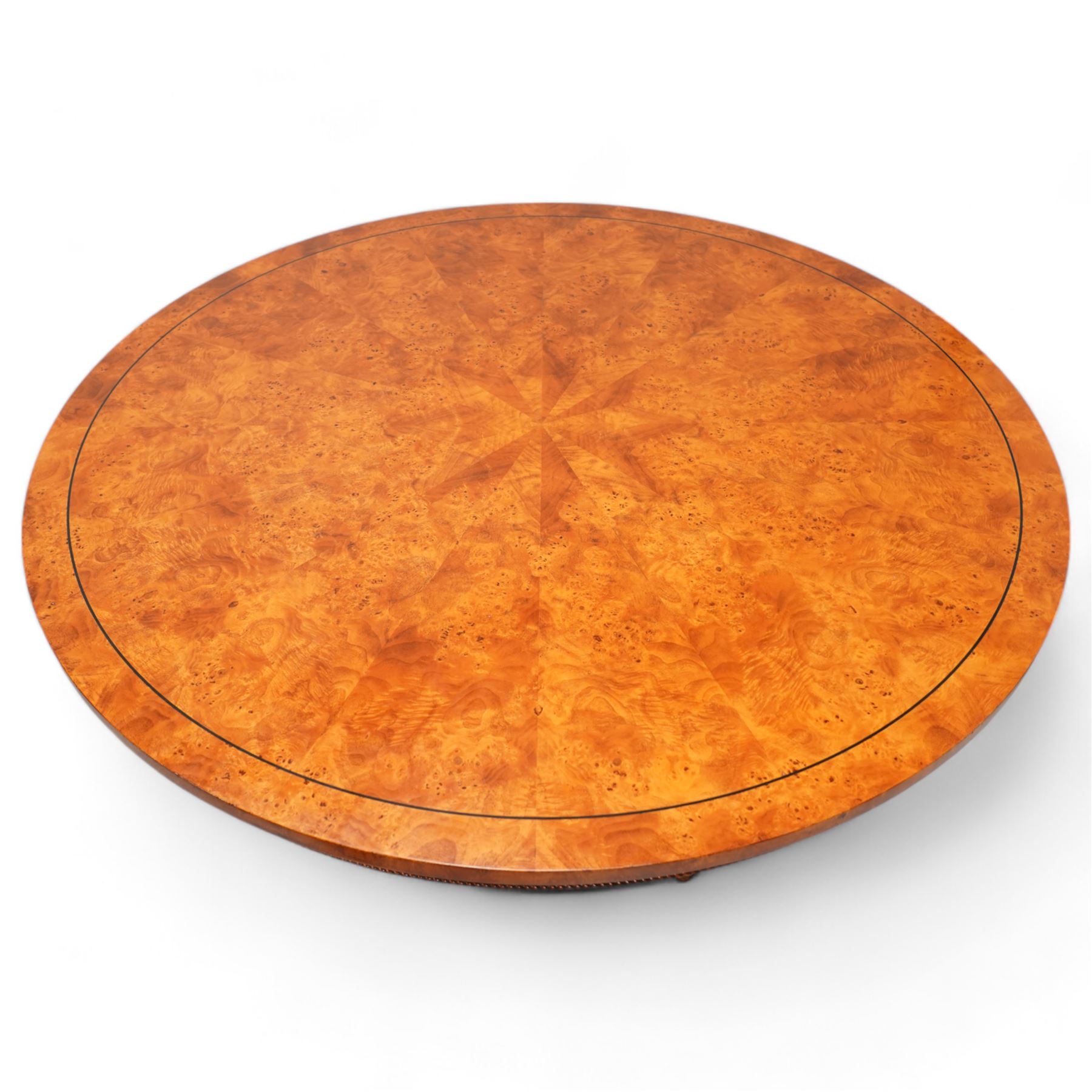 Regency design figured elm centre table, circular top with segmented veneers and ebony band, the frieze decorated with applied twist moulding, on tapered triangular pyramid pedestal, S-scroll carved feet