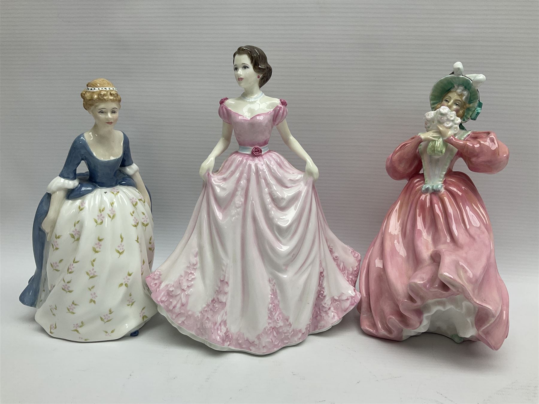 Nine Royal Doulton Figures including; Margarite HN1928, Autumn Breezes HN1034, Hope HN4097, Alison HN2336, Top of the Hill HN1834 and four others (9)